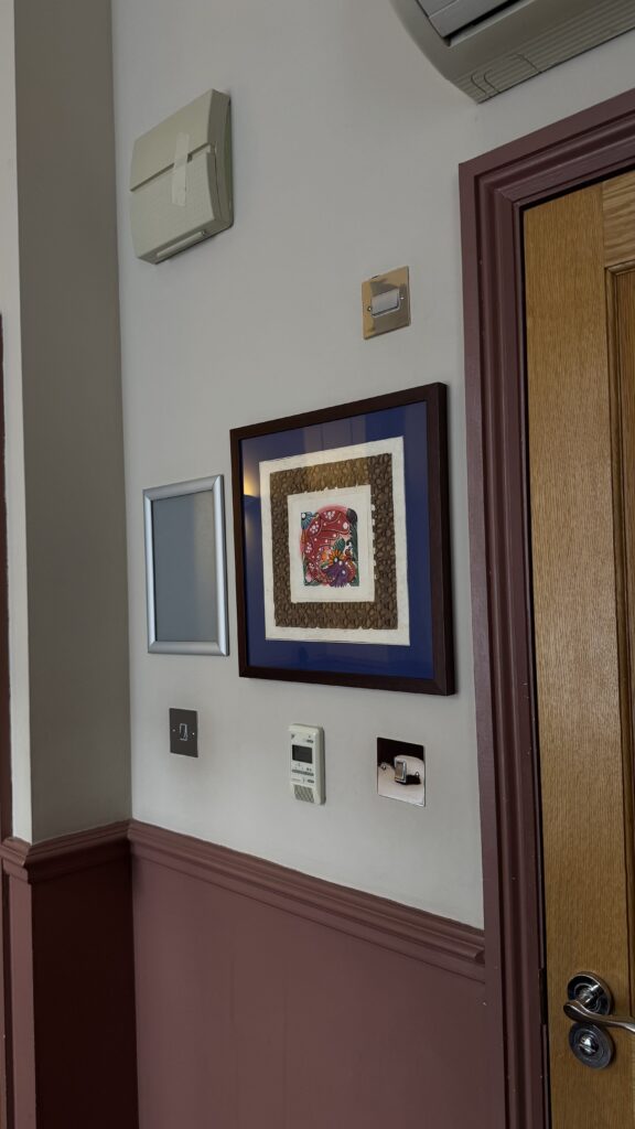 Painting on the wall in a hotel double room