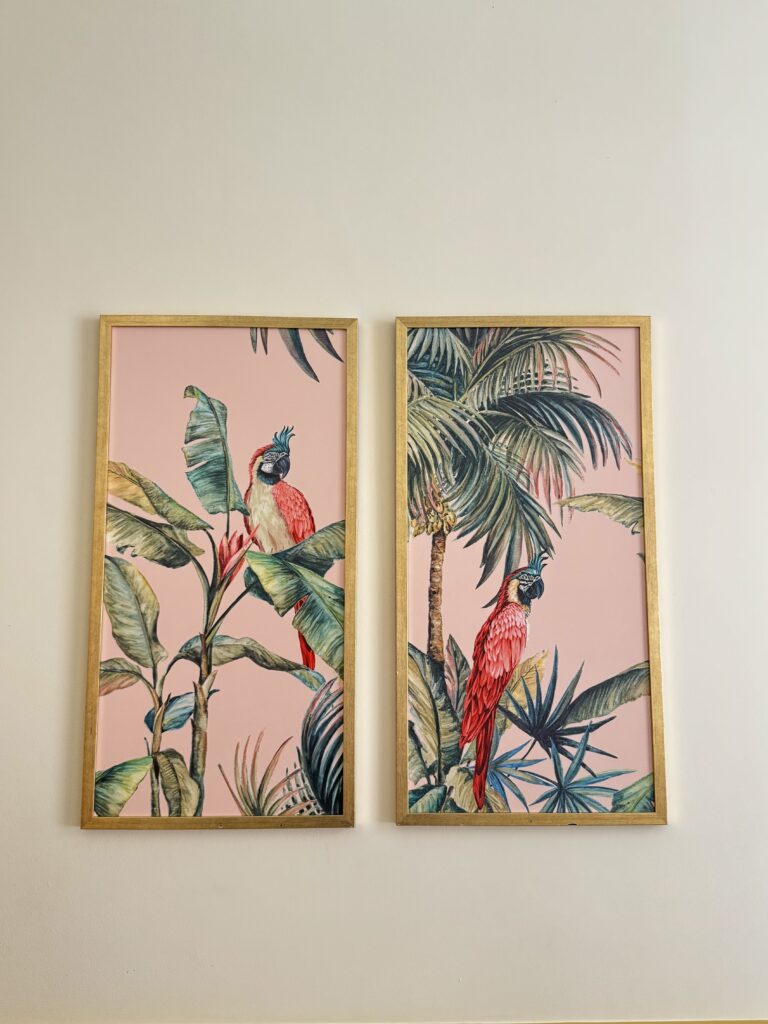 tropical paintings on the wall of hotel bedroom